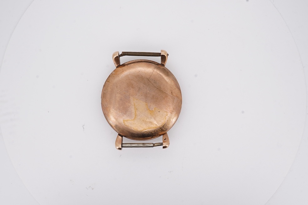 A gentleman's 1940's? 9ct gold Rolex manual wind wrist watch, with signed Super Balance movement, the inner case back numbered 4411 over 844, case diameter 34mm, no strap or winding crown. Condition - poor